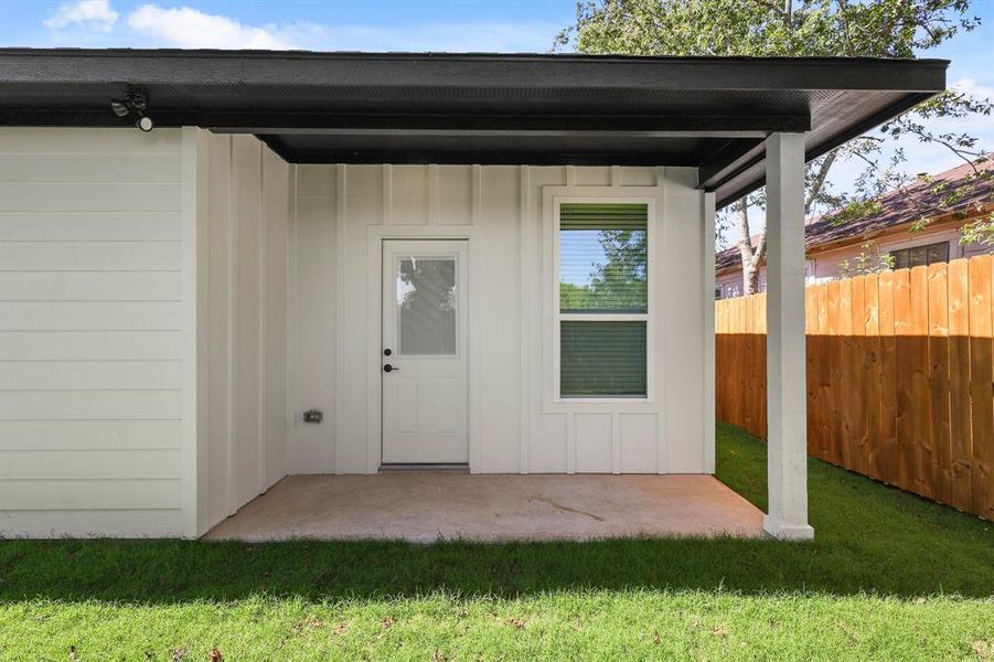 View of outbuilding with a yard