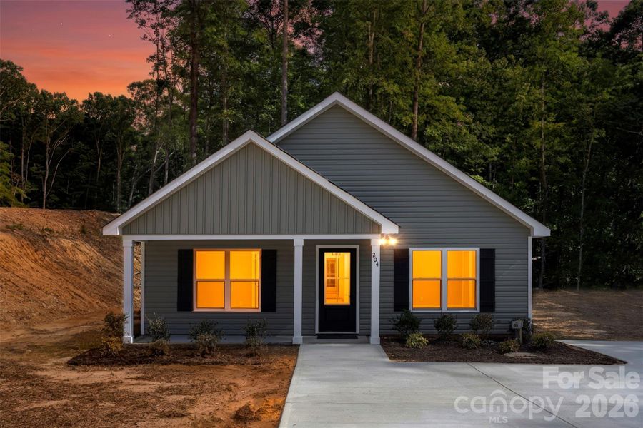 Front exterior of a new home in , Albemarle, NC, highlighting curb appeal (Image 21).