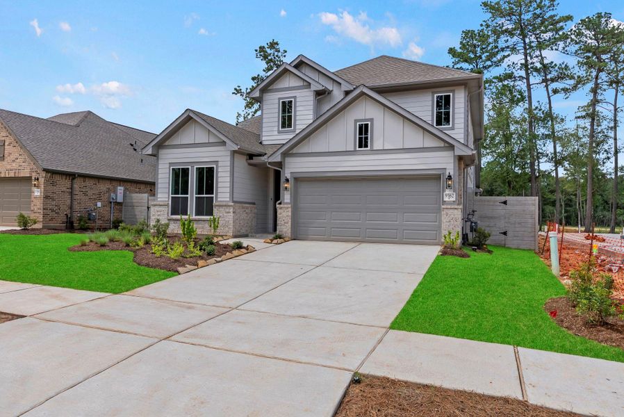 Front exterior of a new home in Two Step Farm, Montgomery, TX, highlighting curb appeal (Image 22). Front exterior of a new home in Two Step Farm, Montgomery, TX, highlighting curb appeal (Image 22).