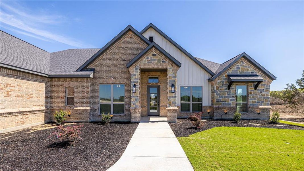 View of front of house with a front yard