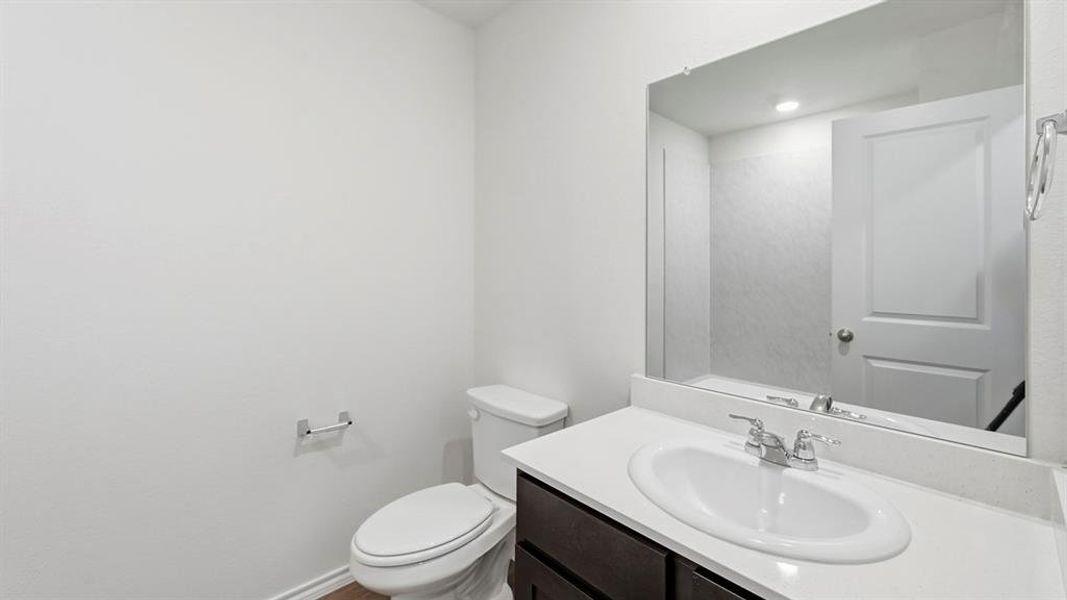 Bathroom featuring vanity and toilet Bathroom featuring vanity and toilet