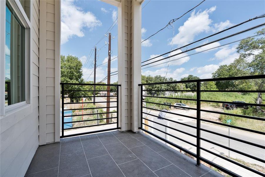 This balcony offers a peaceful outdoor spot, designed for both function and style, making every moment outside worthwhile.