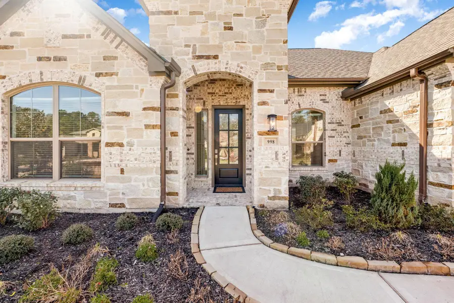 Exterior details and patio area of a home in Stewart’s Forest, Conroe (Image 3).