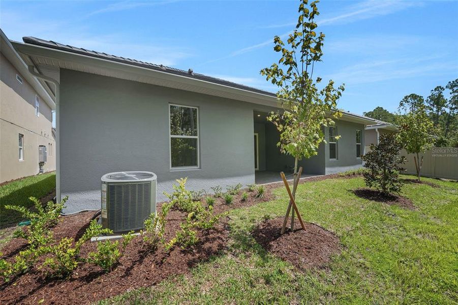 Exterior details and patio area of a home in Palms at Windermere, Windermere (Image 38).