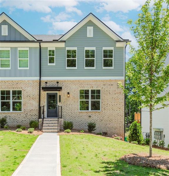 Front exterior of a new home in Hillcrest Landing, Sugar Hill, GA, highlighting curb appeal (Image 25). Front exterior of a new home in Hillcrest Landing, Sugar Hill, GA, highlighting curb appeal (Image 25).