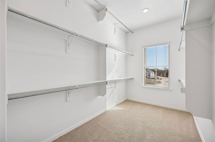 This dream owner's closet filled with natural light and seasonal hanging space is waiting for you!