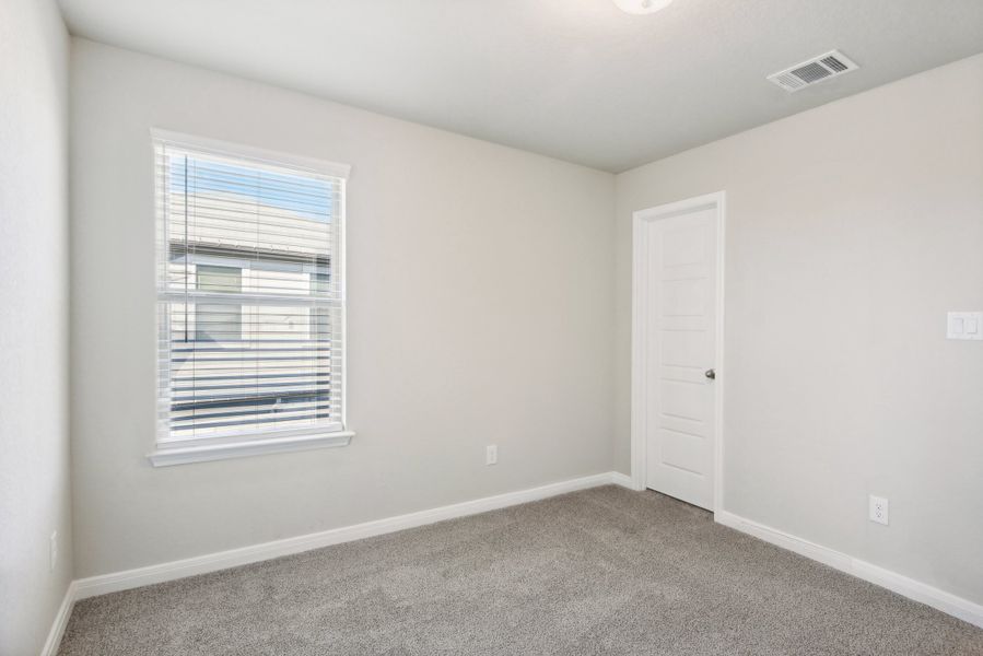 Guest bedroom in the Medina floorplan at a Meritage Homes community.