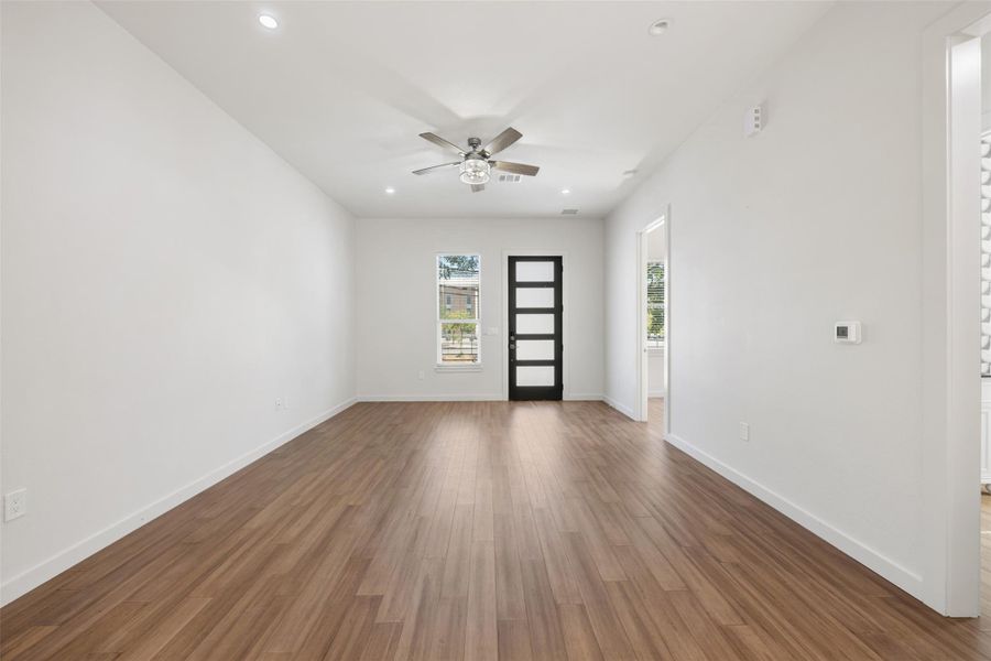 Unfurnished room with recessed lighting, dark wood-style flooring, and ceiling fan