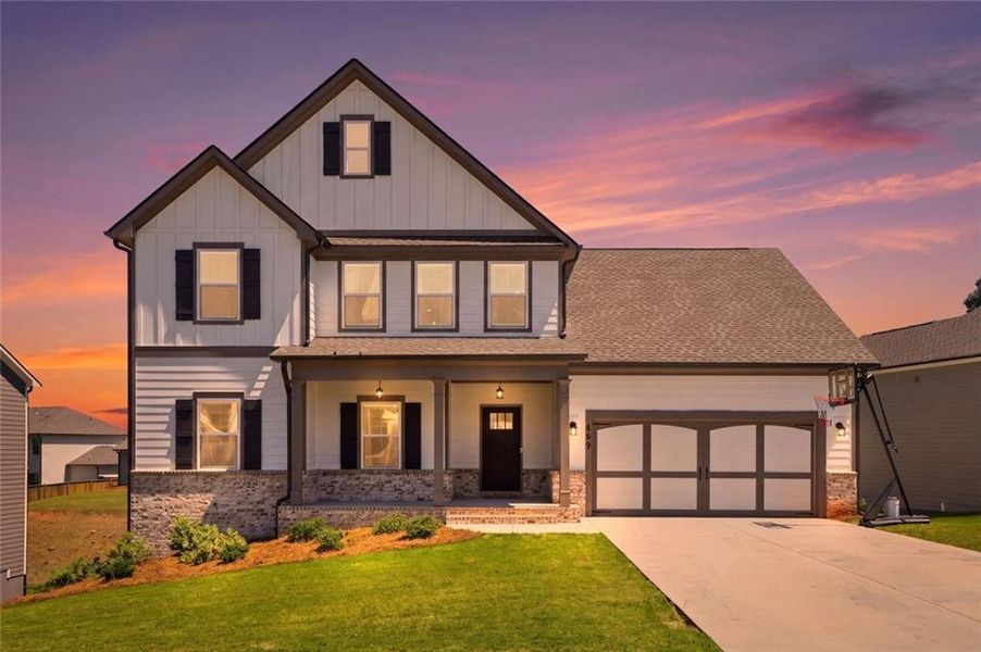 Front exterior of a new home in Calgary Downs, Winder, GA, highlighting curb appeal (Image 2). Front exterior of a new home in Calgary Downs, Winder, GA, highlighting curb appeal (Image 2).