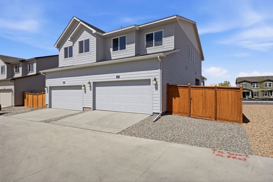 Front exterior of a new home in Sky Ranch, Watkins, CO, highlighting curb appeal (Image 20).