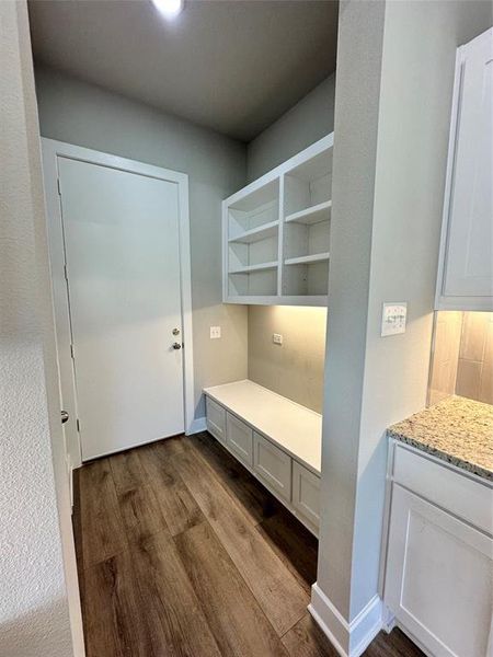 Mudroom featuring wood-type flooring