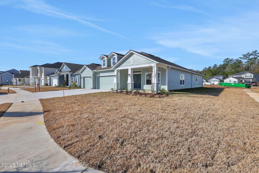 Front exterior of a new home in , Middleburg, FL, highlighting curb appeal (Image 1). Front exterior of a new home in , Middleburg, FL, highlighting curb appeal (Image 1).