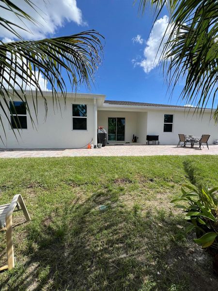Front exterior of a new home in , Palm Bay, FL, highlighting curb appeal (Image 20).