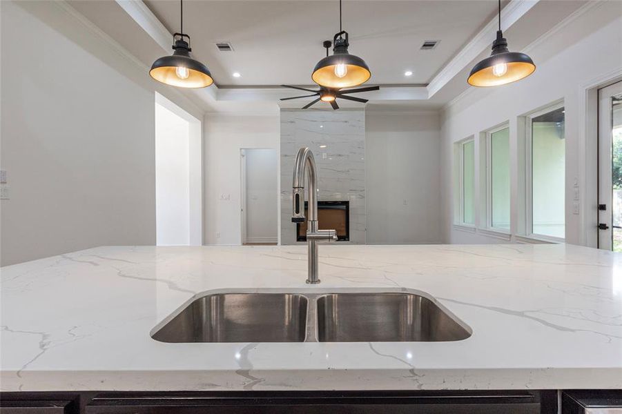 The stainless steel under-mount sink faces the living area so you can watch TV while also doing the dishes.