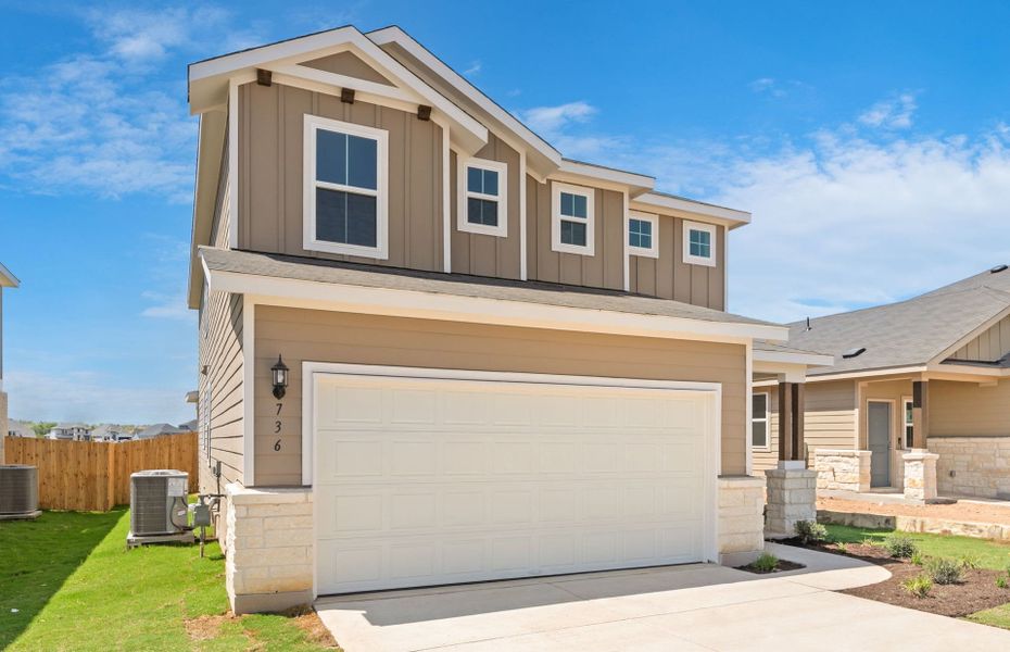 Front exterior of a new home in Sunfield, Buda, TX, highlighting curb appeal (Image 17). Front exterior of a new home in Sunfield, Buda, TX, highlighting curb appeal (Image 17).