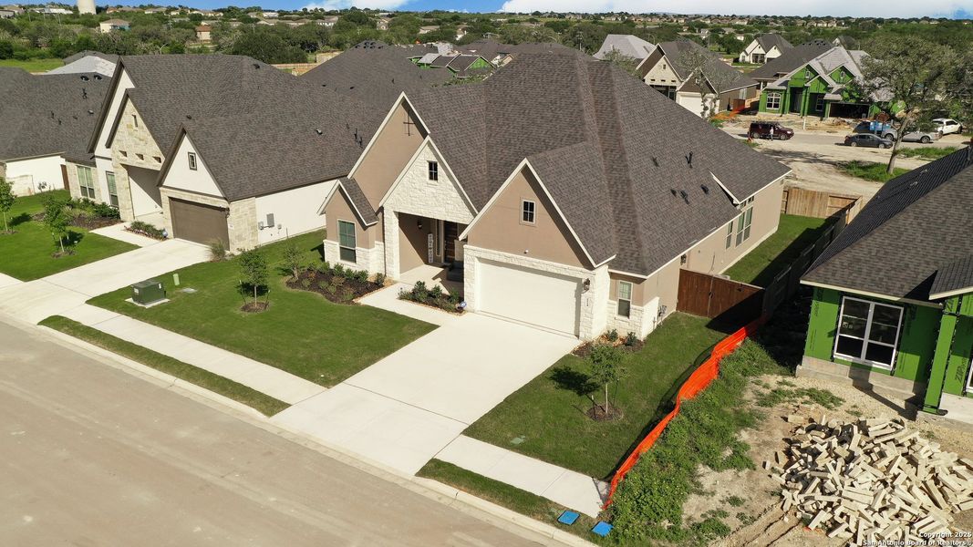 Front exterior of a new home in Mesa Western, Cibolo, TX, highlighting curb appeal (Image 22).