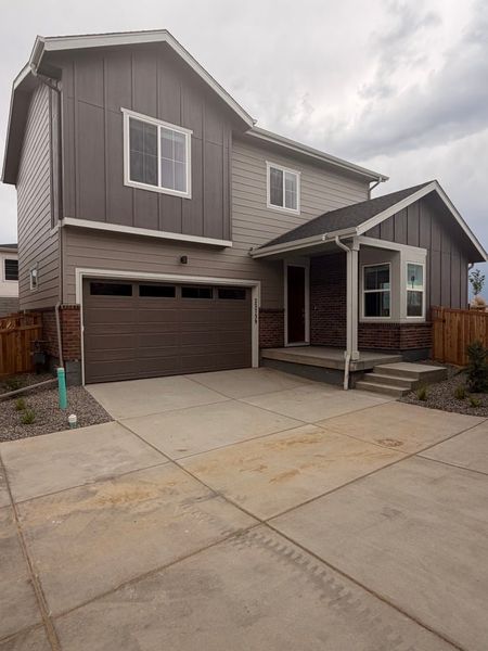 Front exterior of a new home in Windler, Aurora, CO, highlighting curb appeal (Image 1). Front exterior of a new home in Windler, Aurora, CO, highlighting curb appeal (Image 1).