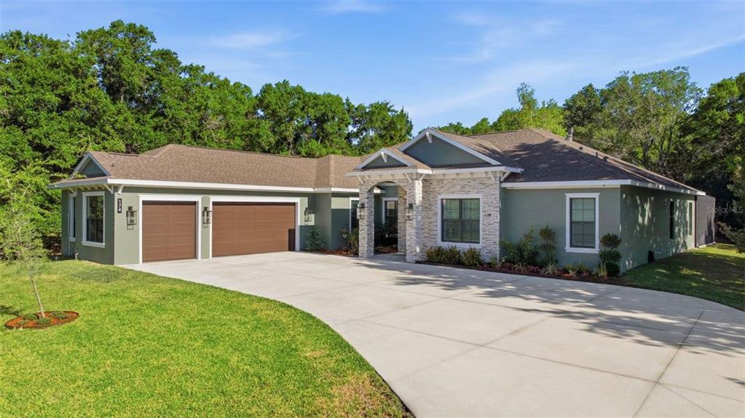 Front exterior of a new home in , Tarpon Springs, FL, highlighting curb appeal (Image 20).