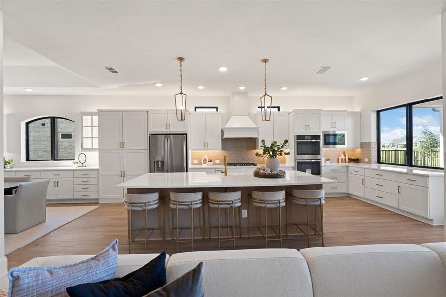 Kitchen opens to spacious living area