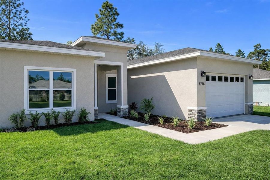 Front exterior of a new home in , Citrus Springs, FL, highlighting curb appeal (Image 20).