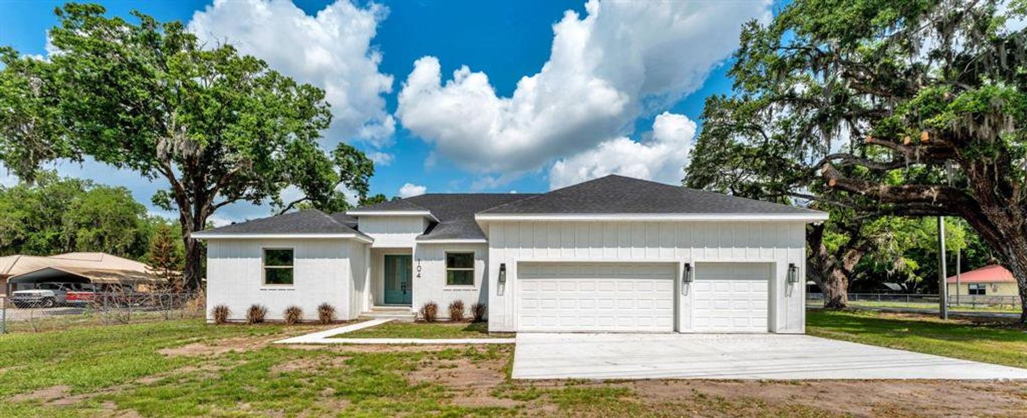 Front exterior of a new home in , Plant City, FL, highlighting curb appeal (Image 1). Front exterior of a new home in , Plant City, FL, highlighting curb appeal (Image 1).