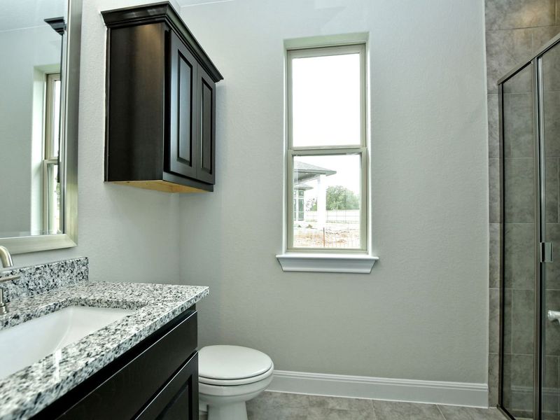Representative furnished interior of a home built from the Madera II by Giddens Homes in Scofield Farms Estates, Georgetown (Image 240).