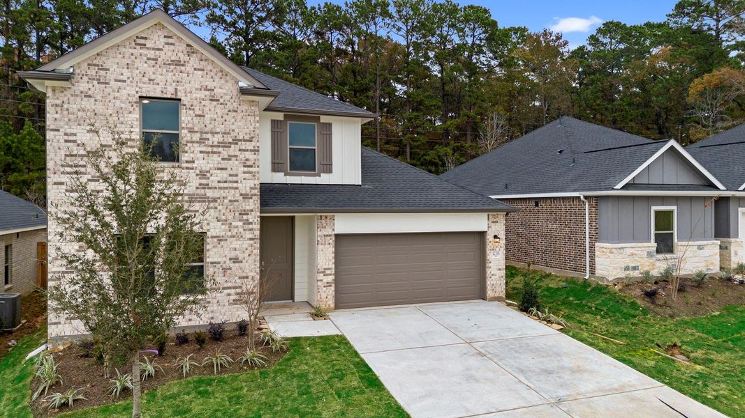 Front exterior of a new home in Westridge Cove 50', Conroe, TX, highlighting curb appeal (Image 19).