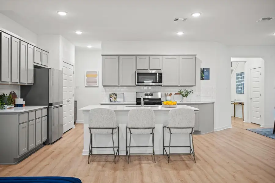 Kitchen in the Oak home plan by Trophy Signature Homes – REPRESENTATIVE PHOTO