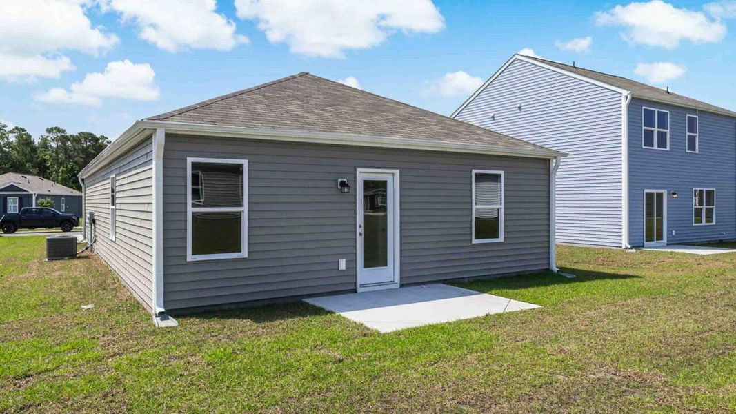 Representative exterior photo of a completed home built from the Devon by D.R. Horton in Eagle Creek, Bolivia, NC (Image 18).