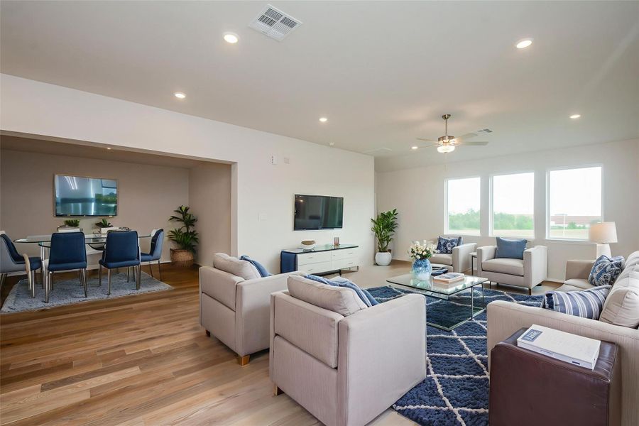 The beautiful, easy-to-maintain flooring flows throughout the home.