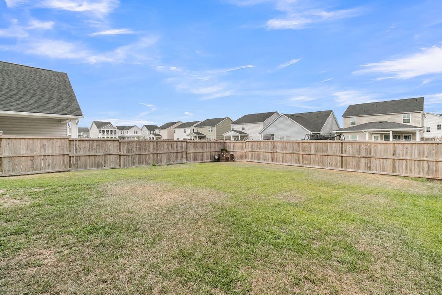Exterior details and patio area of a home in Sweetgrass at Summers Corner, Summerville (Image 26).