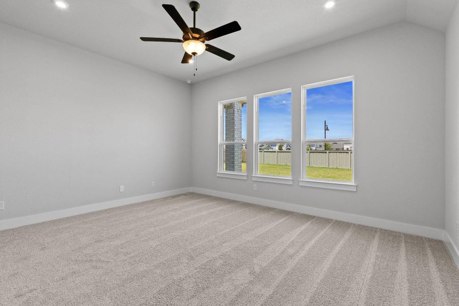 Primary Bedroom with elevated ceiling Primary Bedroom with elevated ceiling