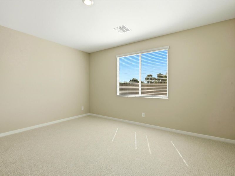 Spacious, unfurnished interior of a new home in White Tank Foothills Signature Series, Waddell (Image 12).
