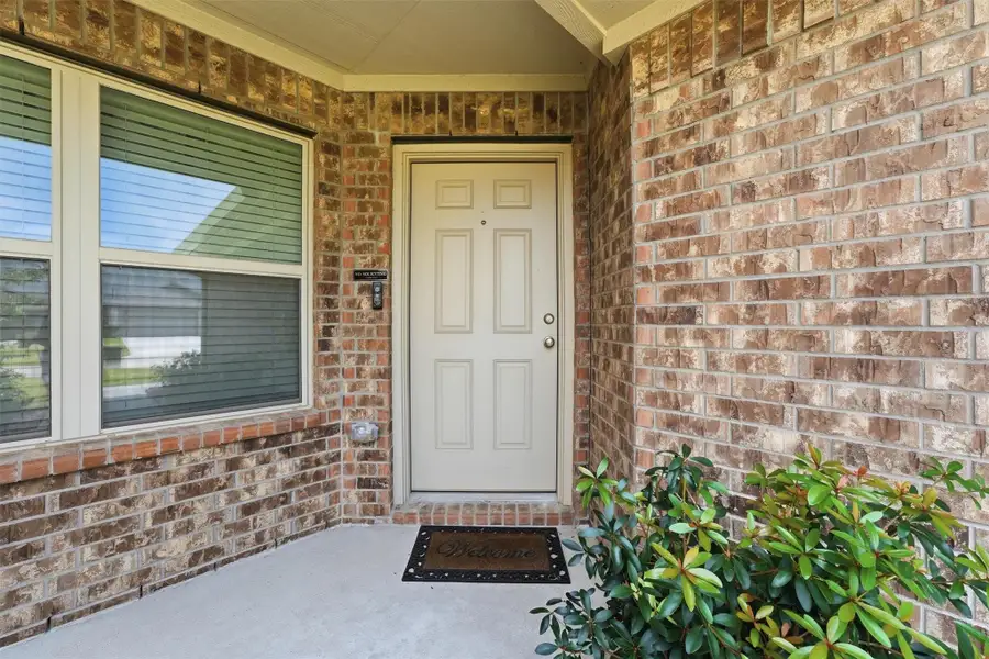 Exterior details and patio area of a home in Pinewood at Grand Texas, New Caney (Image 4).