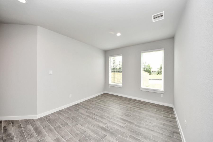 Create lasting memories with your family and friends at the dining table! This expansive dining room showcases sophisticated flooring, custom paint, and seamlessly connects to the family room and kitchen, providing an open and inviting atmosphere. Sample photo of completed home with similar floor plan. Actual colors and selections may vary. Create lasting memories with your family and friends at the dining table! This expansive dining room showcases sophisticated flooring, custom paint, and seamlessly connects to the family room and kitchen, providing an open and inviting atmosphere. Sample photo of completed home with similar floor plan. Actual colors and selections may vary.