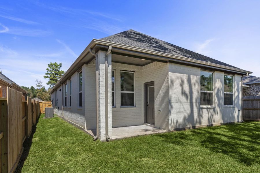 Exterior details and patio area of a home in The Woodlands Hills, Willis (Image 4). Exterior details and patio area of a home in The Woodlands Hills, Willis (Image 4).