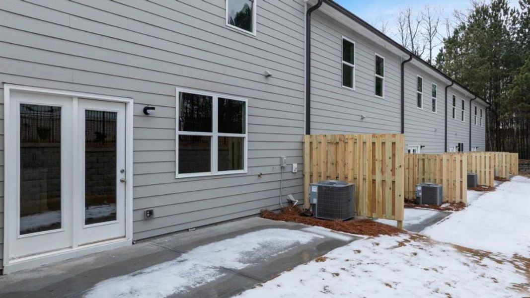 Exterior details and patio area of a home in Waypoint, Flowery Branch (Image 4).