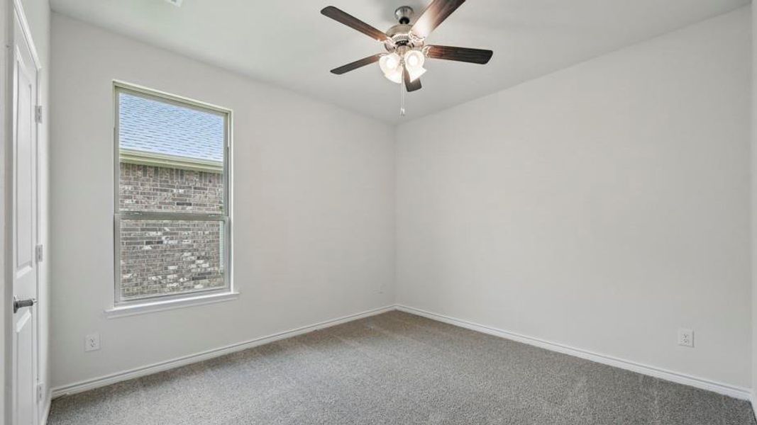 Bright room featuring light gray carpeting and white painted walls