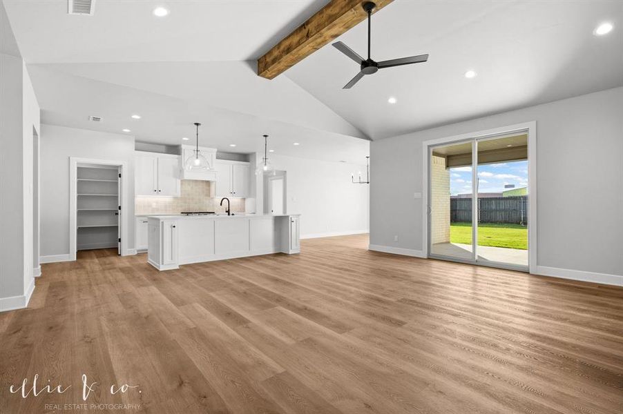 Unfurnished living room featuring ceiling fan, recessed lighting, and light wood-type flooring