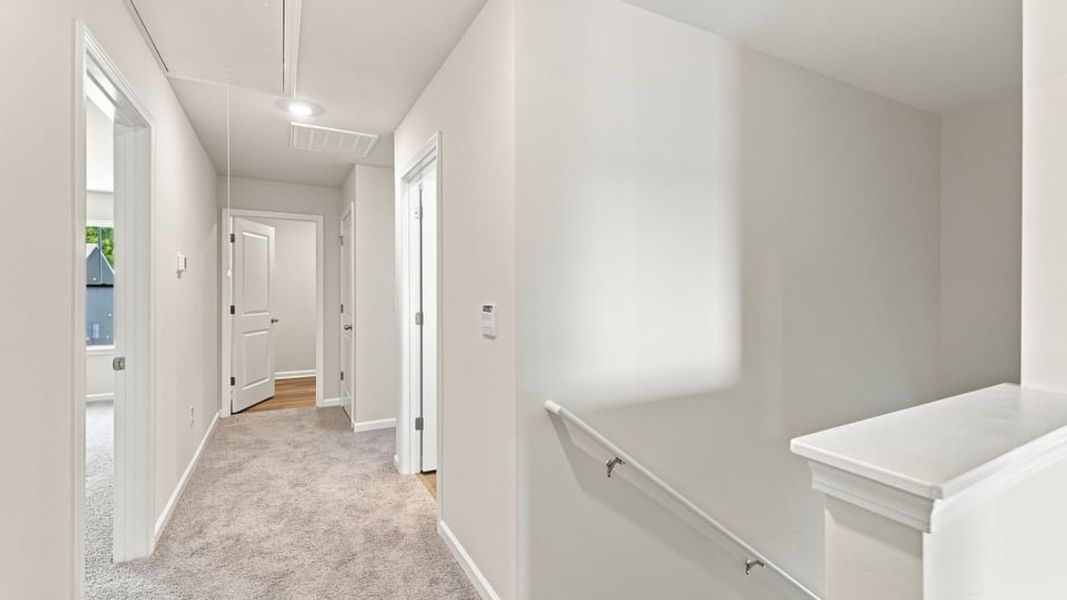 Spacious, unfurnished interior of a new home in Bentley Park, Greenwood (Image 24).