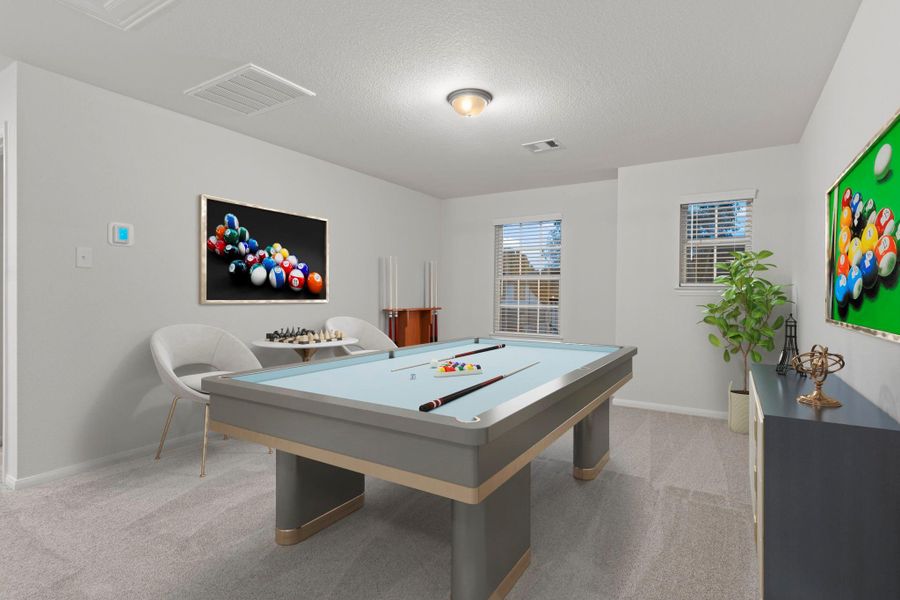 The virtually staged game room offers a fun and flexible space perfect for recreation, media, or hobbies. Large windows brighten the room, making it an ideal spot for entertaining family and friends.