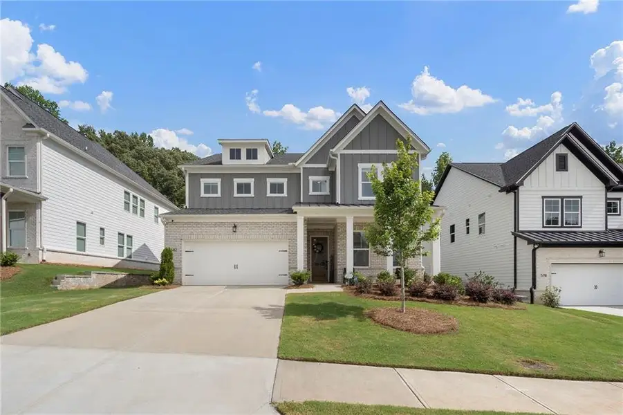 Front exterior of a new home in , Woodstock, GA, highlighting curb appeal (Image 28). Front exterior of a new home in , Woodstock, GA, highlighting curb appeal (Image 28).