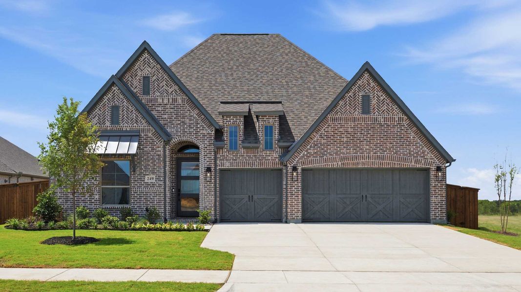 Front exterior of a new home in Myrtle Creek, Waxahachie, TX, highlighting curb appeal (Image 1). Front exterior of a new home in Myrtle Creek, Waxahachie, TX, highlighting curb appeal (Image 1).