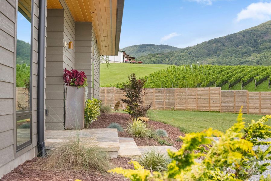 Front exterior of a new home in , Hendersonville, NC, highlighting curb appeal (Image 24).