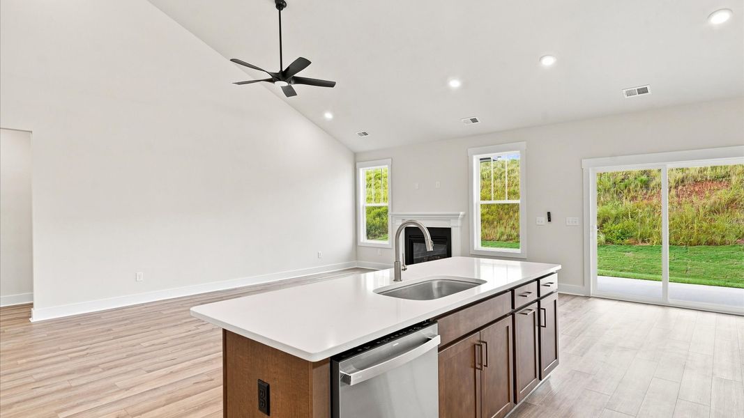 Well-designed kitchen with a center island and tasteful finishes that elevate everyday living at Wells Crossing
