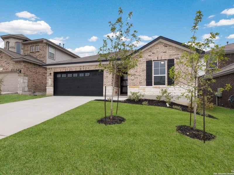 Front exterior of a new home in Bricewood, San Antonio, TX, highlighting curb appeal (Image 27).
