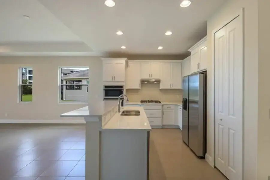 Representative furnished interior of a home built from the Boca Grande by Medallion Home in Reflection Villas at Watercolor Place, Bradenton (Image 6).