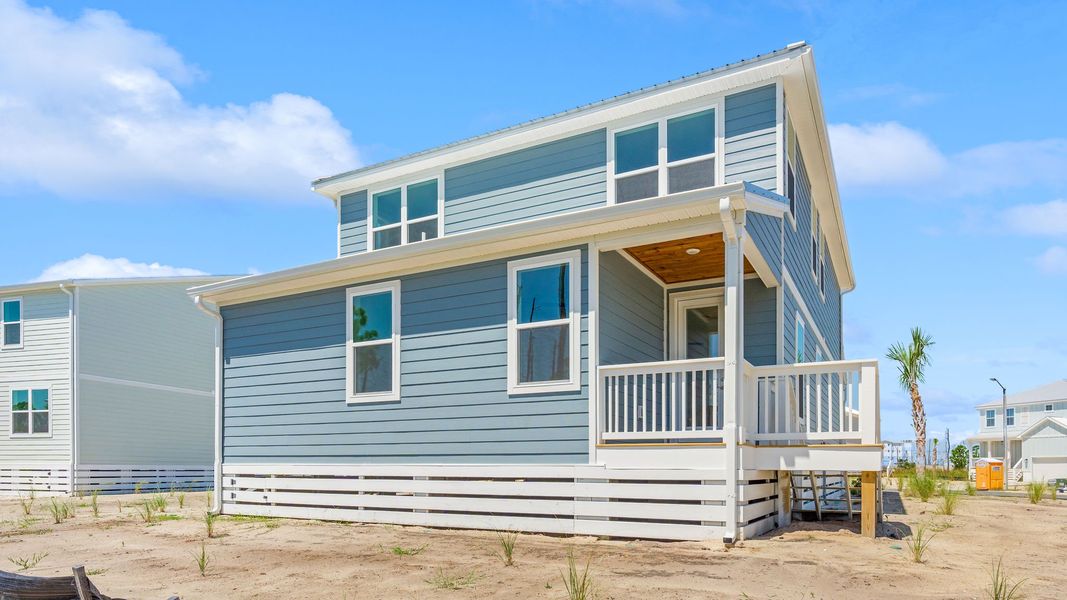 Front exterior of a new home in Redfish Cove at Cape San Blas, Port Saint Joe, FL, highlighting curb appeal (Image 25).