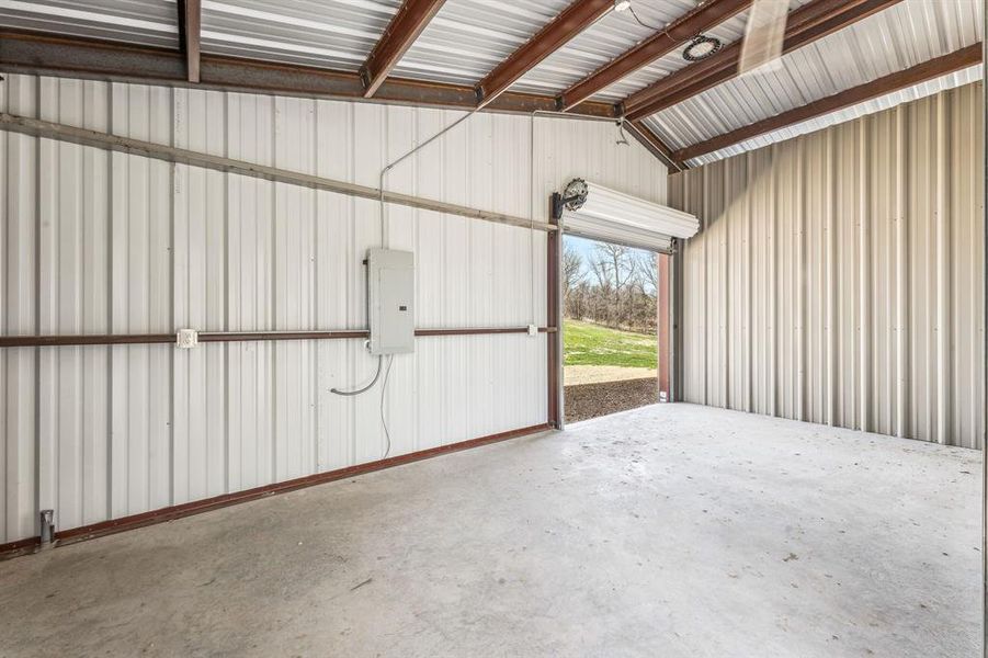 Garage with metal wall and electric panel