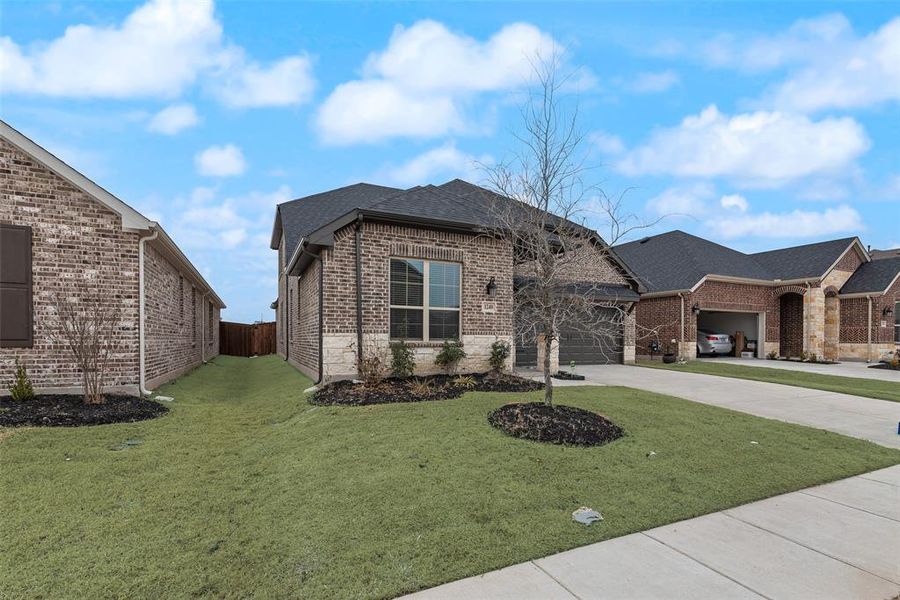 Front exterior of a new home in Walden Pond, Forney, TX, highlighting curb appeal (Image 21).